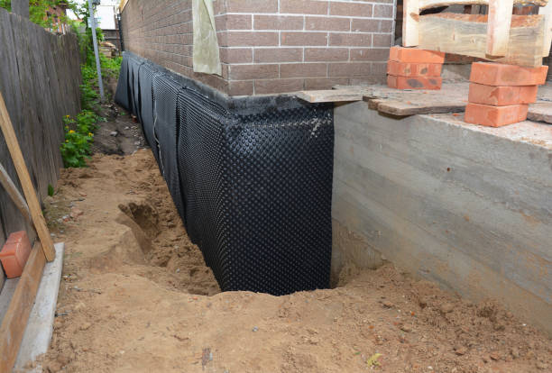 Happy homeowners after waterproofing job in Andale